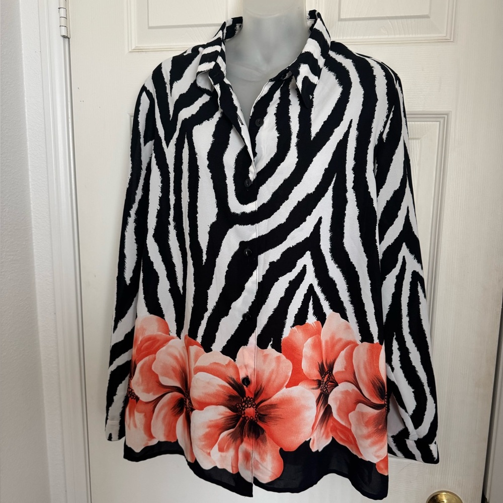 Beautiful brightly colored blouse. Good condition.  Black, white and orange.